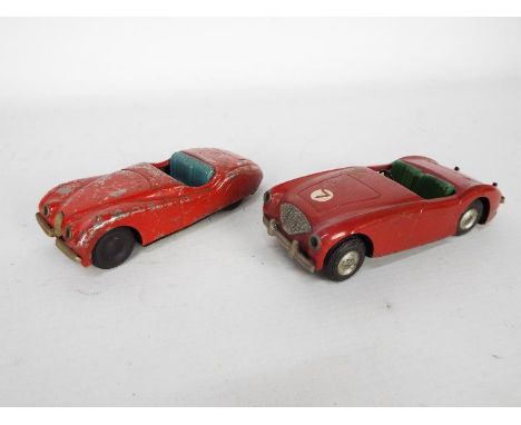 Scalex - 2 x tinplate cars, a Jaguar XK 120 Roadster and an Austin Healey, both models are in play worn condition, the Jaguar