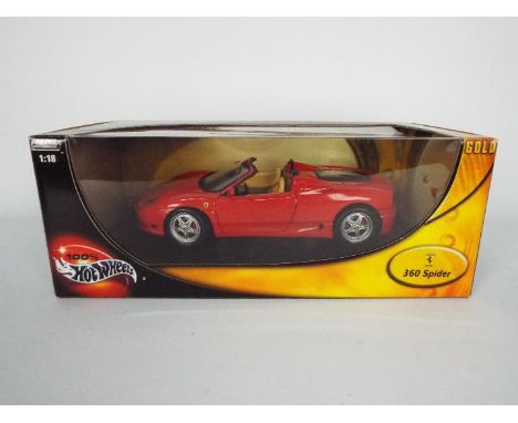 Hot Wheels - A boxed 1:18 scale Hot Wheels #57310 Ferrari 360 Spider. The model in Red appears to be in Mint condition housed