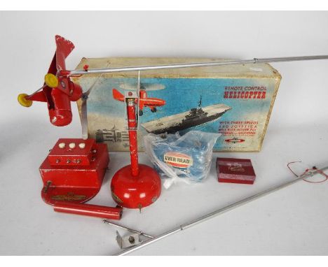 Nulli Secundus - A boxed vintage Remote Control Helicopter. The metal model shows signs of age and play use and there are sig