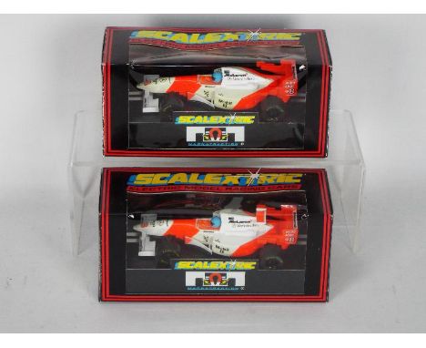 Scalextric - Two boxed 1990's F1 slot cars from Scalextric. Lot consists of C.2004 McLaren F1 RN8 ; together with C.685 McLar