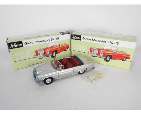 Schuco - A boxed clockwork Girato Mercedes 250 SE Cabrio in 1:20 scale. # 01202. The car appears Mint in a Very Good box and 