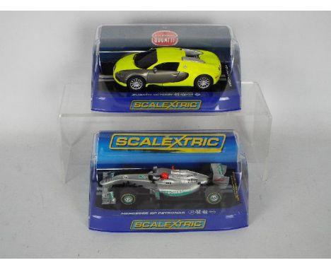 Scalextric - Two boxed 1:32 scale slot cars from Scalextric. Lot consists of Scalextric C3275 Bugatti Veyron; together with C