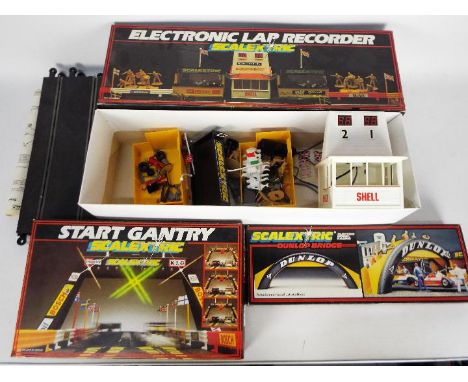 Scalextric - 3 x boxed Accessory Sets, Electronic Lap Recorder # C.273, Start Gantry # C.209 and Dunlop Bridge # C.700 . The 
