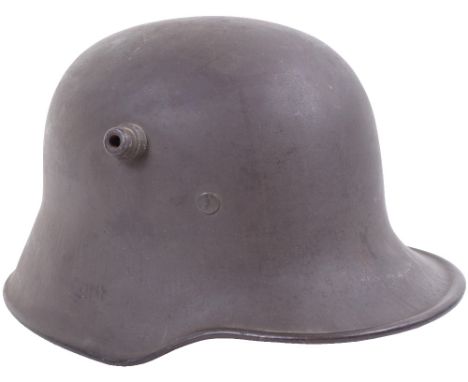 M.18 Trench Helmet, a virtually unused condition M.18 trench helmet, rubber ink stamped size ‘62’ to the inner skirt, retaini