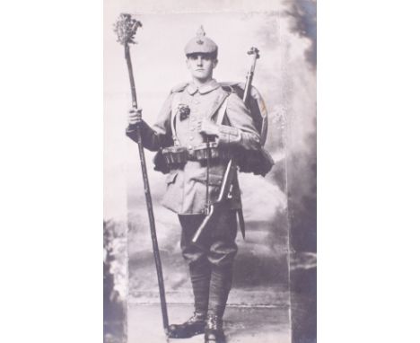 WW1 German Infantry Soldier Postcard Photograph, showing the soldier in full marching order wearing his pickelhaube with cove