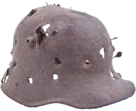 Battle Damaged Field Dug M.16 Trench Helmet Shell, a much shattered shell by shrapnel, ground dug with evidence of chalk soil