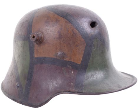 M.16 Camouflage Battle Damaged Trench Helmet, a G 68 sized M 16 camouflage trench helmet from Michael Baldwin’s collection th