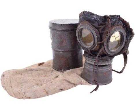 American Souvenired Gas Mask, the cylinder and mask of an M.15/M.16 gas mask, the tin having the majority of its field grey g
