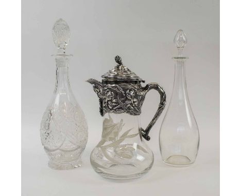 AN ART NOUVEAU STYLE CRYSTAL GLASS, and silver plated lemonade jug, a Baccarat plain glass decanter and a heavily cut glass d