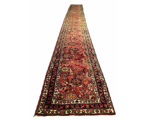 KARAJA LONG RUNNER, 780cm x 81cm, all over palmette and vine design within corresponding bands and borders.