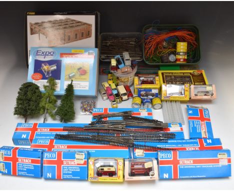 A collection of N gauge model railway buildings, vehicles, track and accessories including Graham Farish 4 Road Engine Shed, 