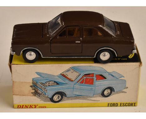 Dinky Toys diecast model 168 Ford Escort with brown body, plated bumpers and trim, 168, in original box.