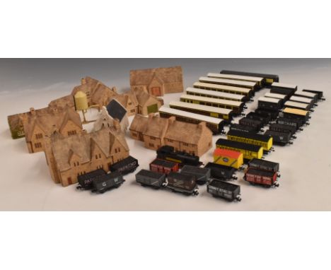 Forty mainly Peco N gauge model railway locomotives, coaches and wagons together with a collection of N gauge ceramic buildin