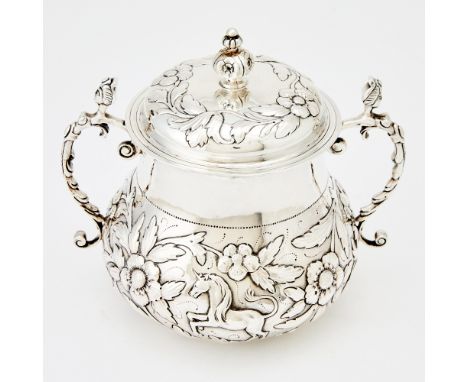 In the Charles II style, the body chased with a lion and unicorn amongst foliage, with two maiden-form handles, the cover wit