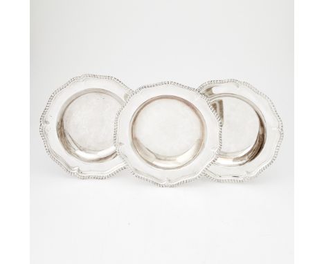 Each shaped circular with gadrooned border. Diameter 9 1/2 inches (24 cm), total approximately 57 ounces.Generally good condi