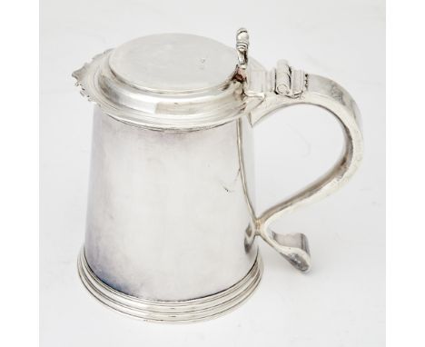 Cylindrical with reeded band at rim and foot, the stepped flat cover with a shaped rim and scrolling thumbpiece. Height 6 3/4