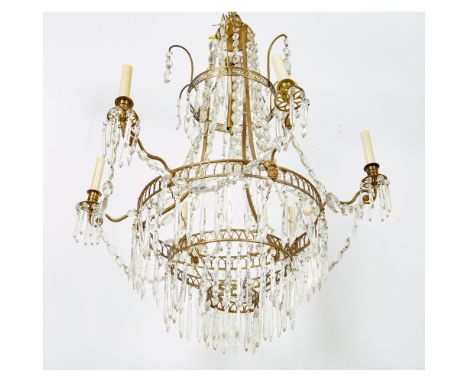 Early 19th CenturyAllover hung with cut-glass pendants, the circular tier cast with female masks and applied with nine candle