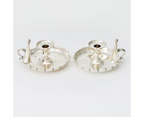 Each of shaped circular form, the foliate scroll handle with a conical snuffer. Length over handle 7 inches (17.7 cm), total 