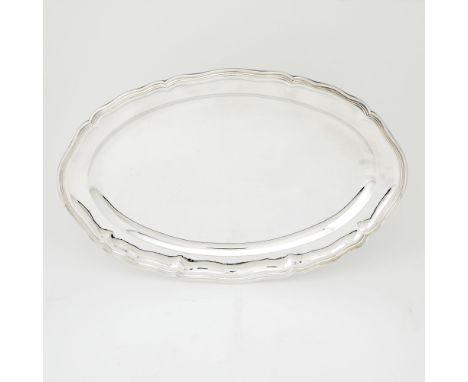 20th CenturyShaped oval with molded rim. Length 23 1/2 inches (60 cm), approximately 65 ounces.Good condition overall with li