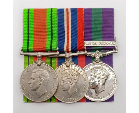 A group of three medals, awarded to 1812486 Sgt R A Quelch RAF, comprising a Defence Medal, a War Medal and a General Service