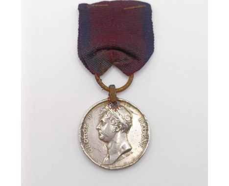 A George III Waterloo Medal, awarded to William Reynolds 51st Reg Light Infantry, with a steel ring suspensiondented and scra