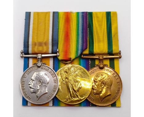 A group of three medals, awarded to 240519 Pte W Knight E Surrey R, comprising a British War Medal and Victory Medal pair, an