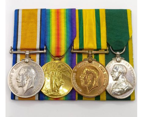 A group of four medals, awarded to 30944 Pte H Gest E Yorks R, comprising a British War Medal, a Victory Medal, a Territorial