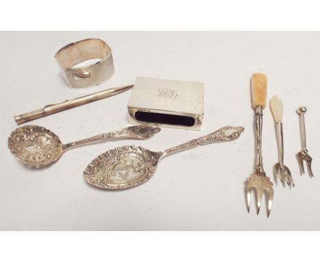 Collection of small silver ware to include a matchbox cover, napkin ring, propelling pencil, cutlery etc. 