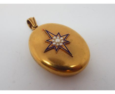 Victorian oval locket, decorated with seed pearl and blue enamel to the top, unhallmarked, tests as 15 ct gold. 5.5 cms long 