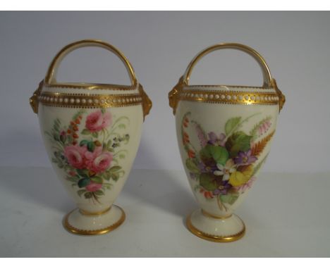Pair of Royal Worcester basket shaped vases, hand painted with sprigs of flowers.  Height 14cm      Condition - no obvious si