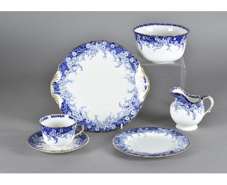 A Royal Doulton twelve place setting blue and white patterned tea service, heightened in gilt comprising, cups, saucers, side