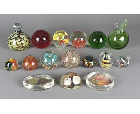 A quantity of European and British glass paperweights, including a large Mdina doorstop and a quantity of flat oval and circu