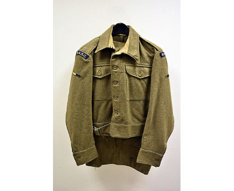 A 1940 pattern battle dress by J.S.Thomson, dated 1944, complete with WD and broad arrow stamp to inner, comprising jacket an