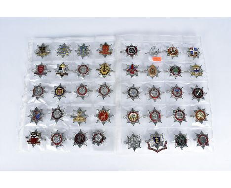 An assortment of 40 British City and County Fire badges, comprising British Aerospace, Hampshire, Hereford and Worcester, Cra
