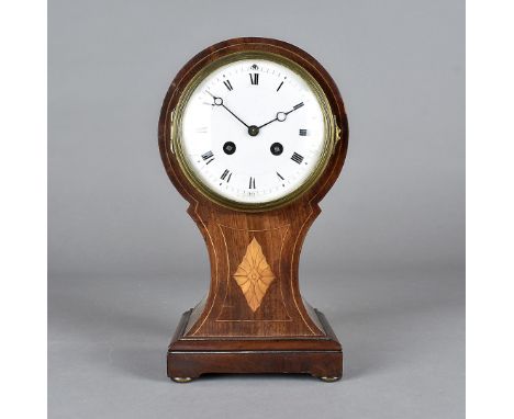 An Edwardian hour glass shaped mahogany and satin strung mantel clock, with eight day French drum striking movement, white en