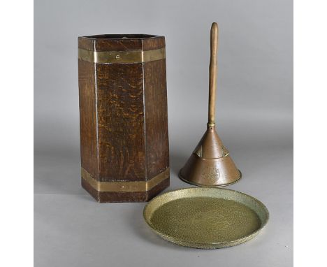 R Alister & Co oak copper bound stick stand, of hexagonal form, 51 cm high together with a copper wash dolly and a brass tray