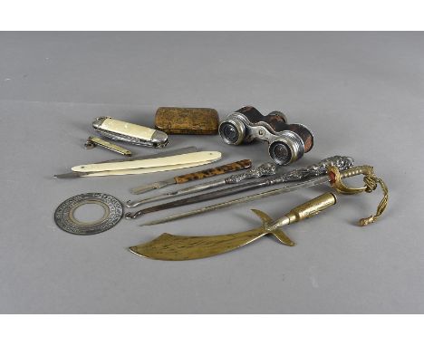 A trench art letter opener, a burr maple snuff box, a naval officers sword letter opener, girl guides penknife and other item