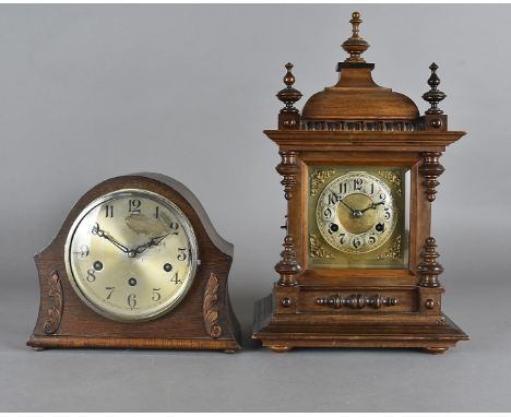 A 19th Century walnut eight day mantel clock, with brass face and arabic numerals, 47 cm high together with an oak domed eigh