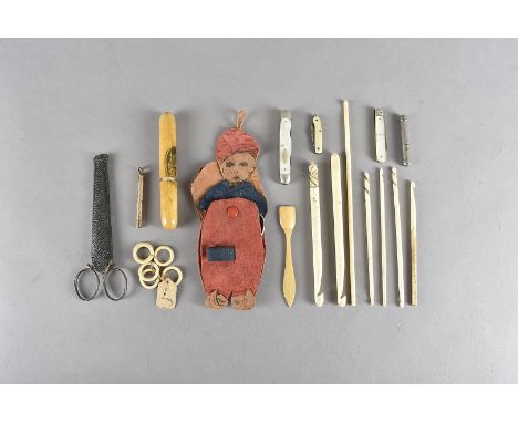 A collection of sewing related items, including a vegetable ivory tape measure with stanhope of Crystal Palace and needle cas