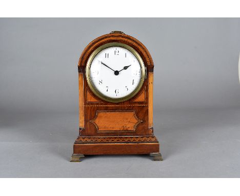 An early 19th Century Sedan clock, the mahogany walnut and crossbanded case of domed form on brass bracket feet, encasing a c