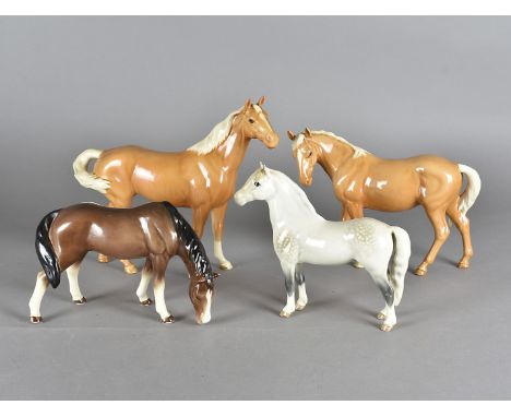 Two Beswick palamino horses, together with a grey stallion marked Welsh M and a Sylvac pony (4)Rubbing to the hooves, origina