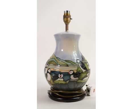 Moorcroft large lamp base decorated with Puffins, on wood plinth, overall height 37cm.