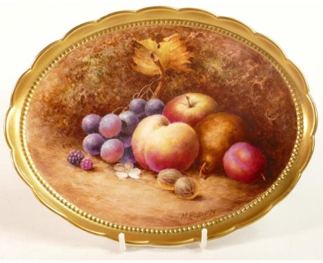 Hand painted oval gilded dish by Milwyn Holloway, of various fruit, L22.5cm. Milwyn Holloway worked at Royal Worcester during