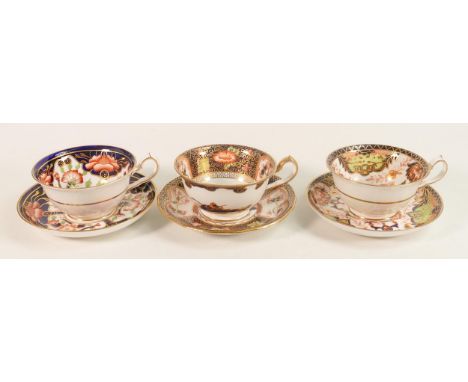 Three Royal Crown Derby early tea cups and saucers decorated in various Imari styles. (6) 