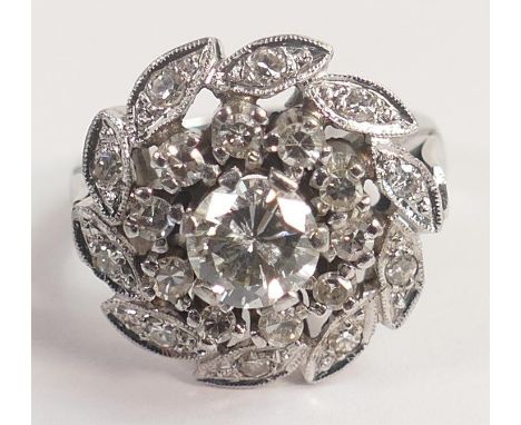 14k white gold diamond cluster ring, centre round diamond approx .80ct surrounded by 10 smaller diamonds and then further sma