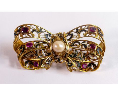 High carat gold gem set brooch.  Gross weight 10.5g, tests as 18ct or better, set with rubies and decorated with black &amp; 
