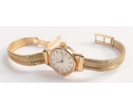 18ct gold Longines ladies wristwatch and 18ct gold bracelet.  Gross weight 22.7g.  Winds, ticks and runs down, keeping reason