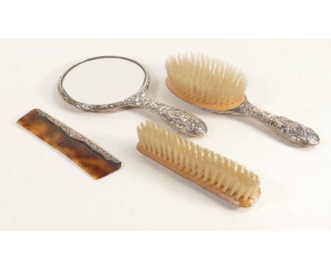 4 piece silver ladies dressing set, hallmarked for Birmingham 1968, comprising hand mirror, comb and two brushes. (4) 