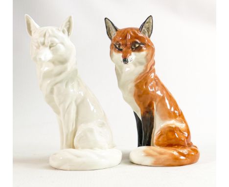 Royal Worcester model of a seated fox 2993, h.18.5cm together with an unmarked all white version of the same model. (2) 