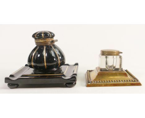 Heavy glass crystal inkwell with brass fittings together with similar pottery item, tallest  11cm. (2) 